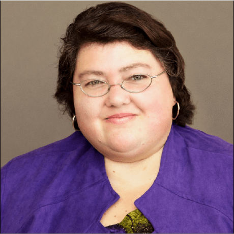 Carla Marvin smiling in a professional portrait.