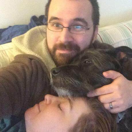 Richard Lee Esquivel
          holding his dog {name}.